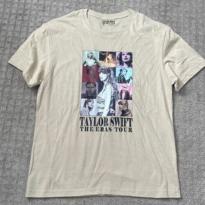 Beige large Taylor Swift t-shirt.